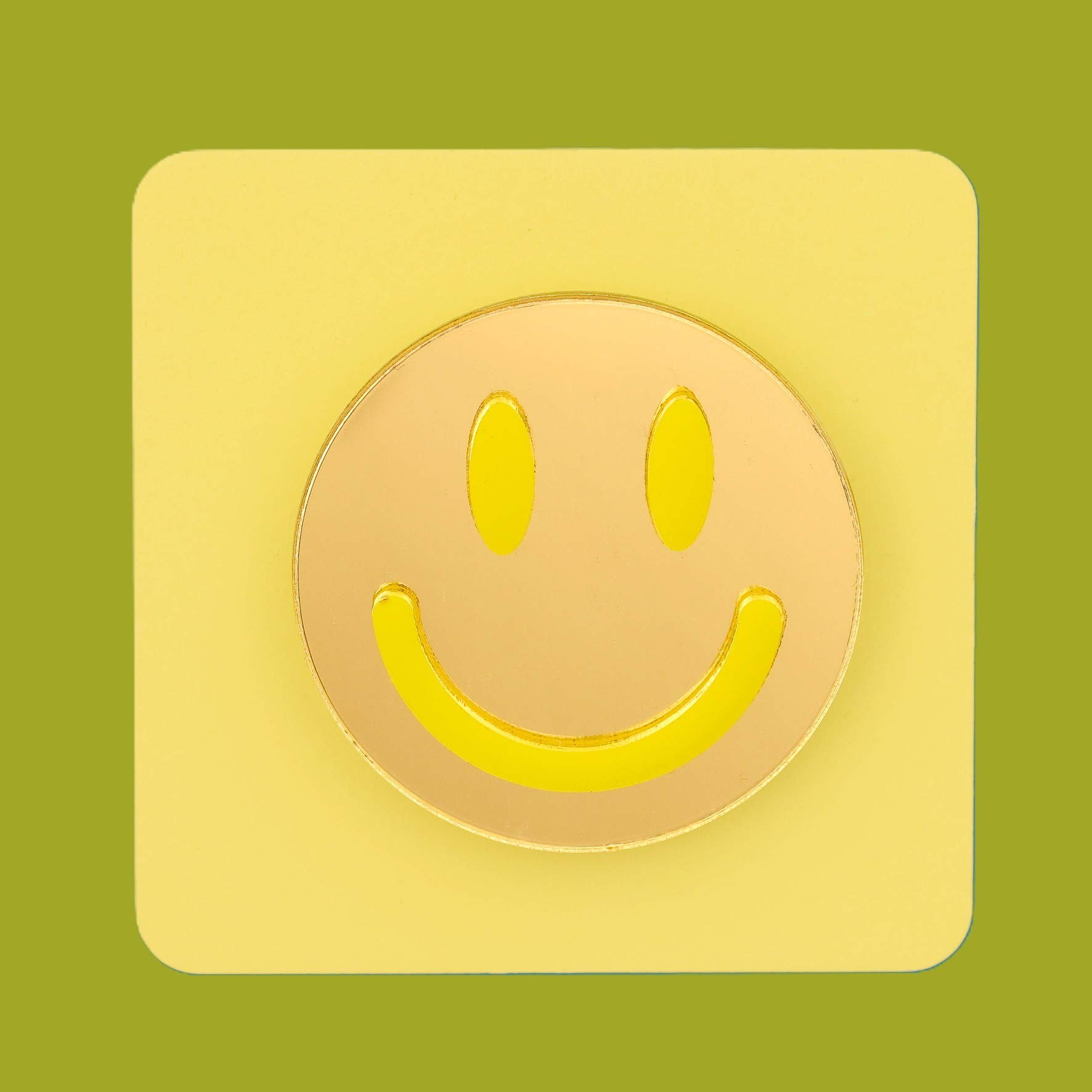 Smiley face brooch