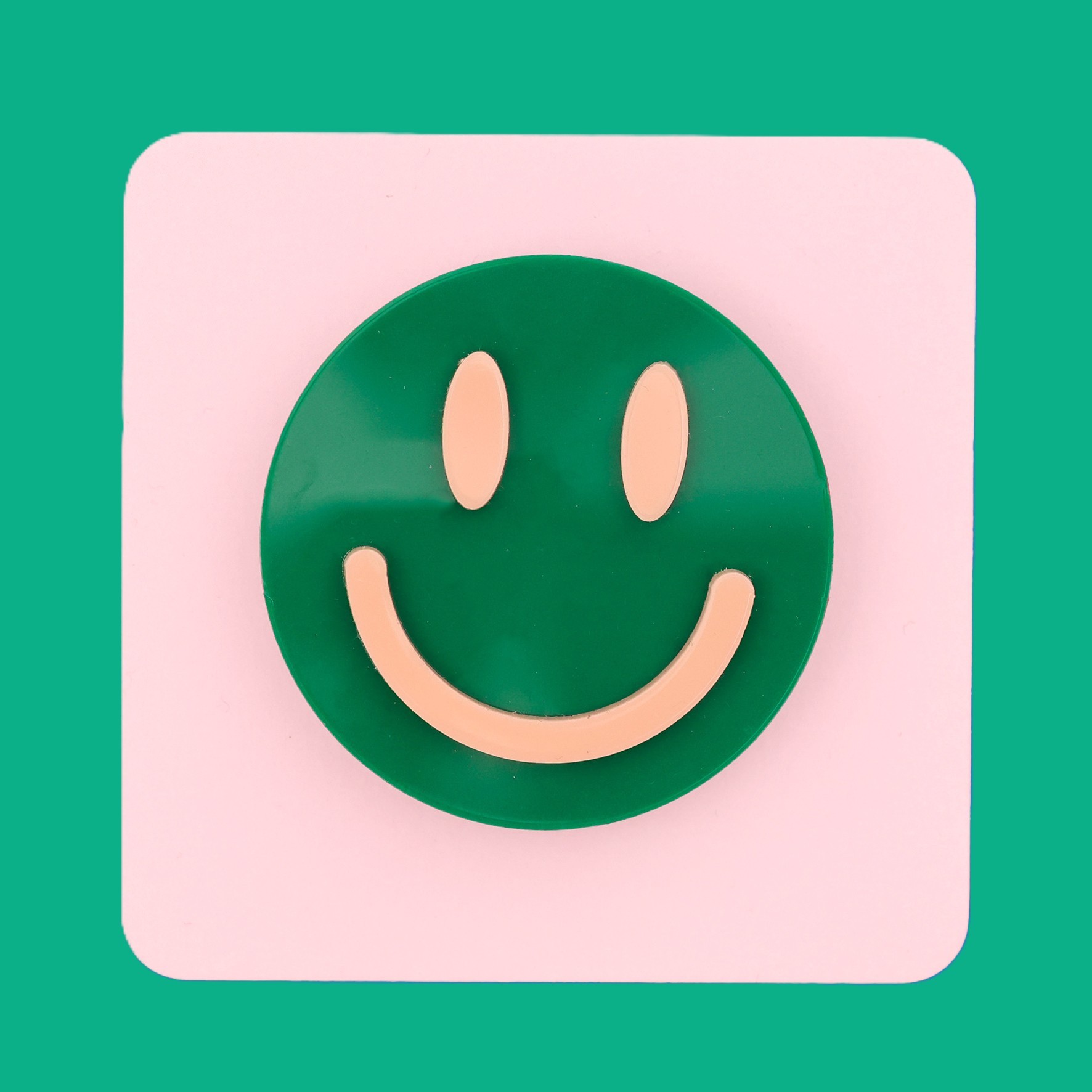 Smiley face brooch