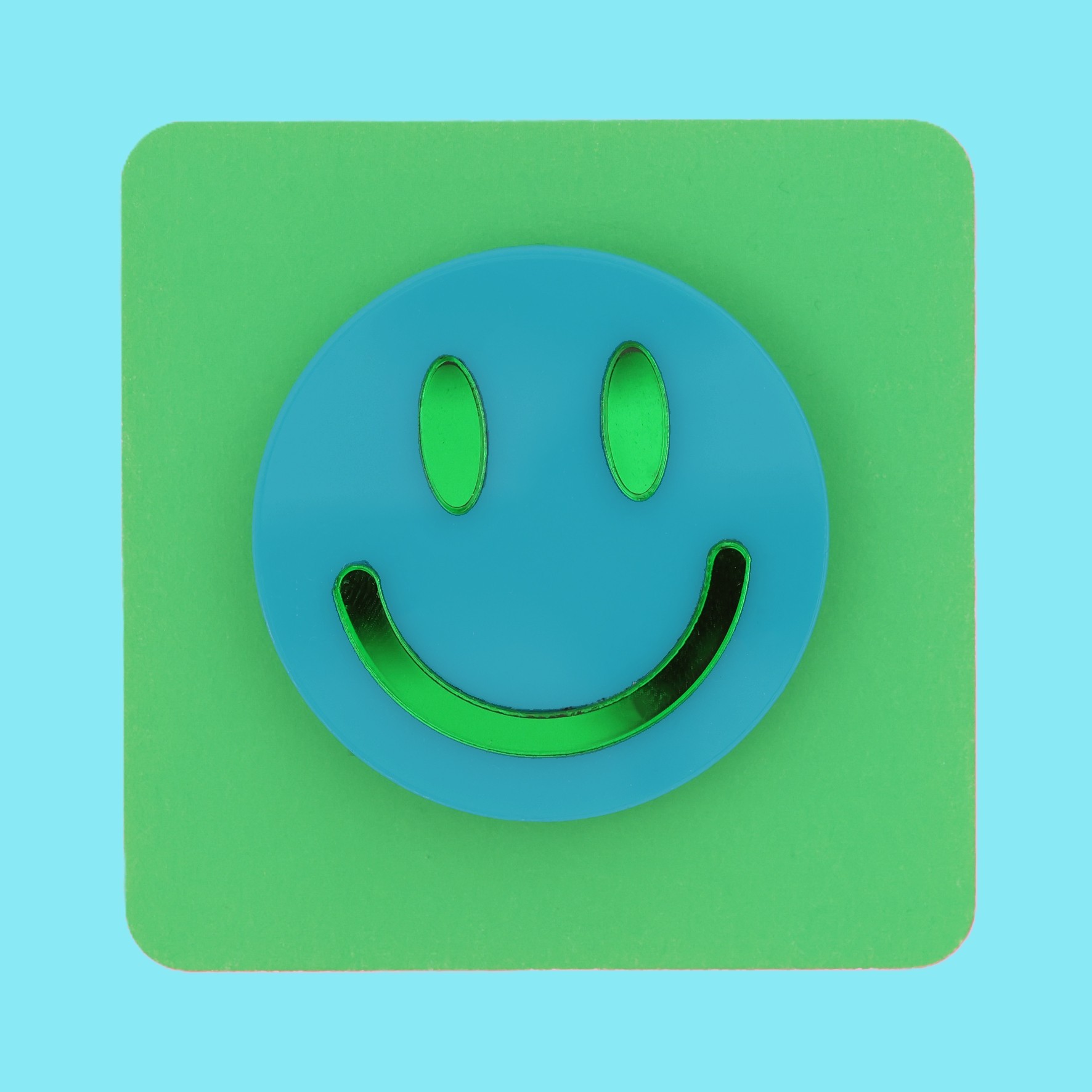 Smiley face brooch