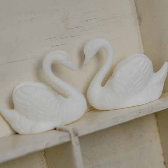 duo of kitsch swans